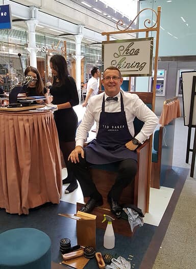 Craig delivering expert shoeshine service